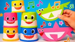 A song about baby sharks with toy paper sharks in a video for children.