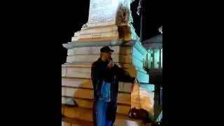 Max Parthas explaining Modern Slavery Abolition under the confederate flag.