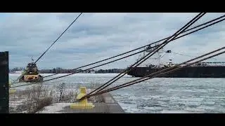 Tugboat Helen H breaking ice by the Atlantic Huron for the Presque Isle lay-up at Port Terminal