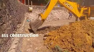 JCB backhoe digging for house foundation work