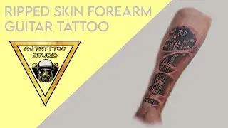 Forearm ripped skin guitar tattoo