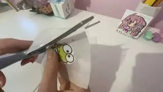 Cute diy stickers. *Materials: paper with drawing, tape, scissors and parchment or wax paper.*