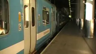 Stansted Express class 317 departing Stansted Airport railway station.