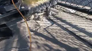 Using a wire brush to clean out mud & compacted dirt on a slide gate opener SL3000UL - Elite Dallas