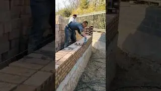 Skilled brick layer construction process of thick brick wall