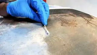 Removing dirt from a 100+ year old painting