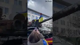 Kateryna Polichuk, the famous singing nurse from Azovstal singing on the destroyed Russian tank