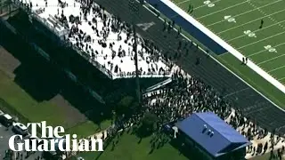 Aerial video shows evacuated students in football field after school shooting in Georgia