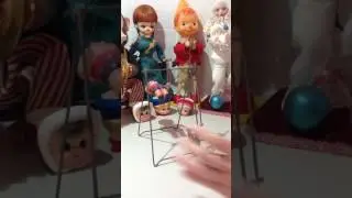 Vintage Celluloid Doll on clockwork swing