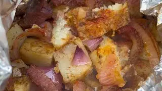 Potatoes in aluminium foil on Pellet Grill