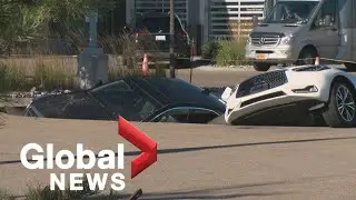 Sinkhole swallows several cars at Edmonton dealership