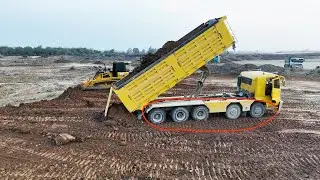 Powerhouse Construction: SHANTUI DH17C3 Bulldozer and 16-Wheel Dumper Truck in Action