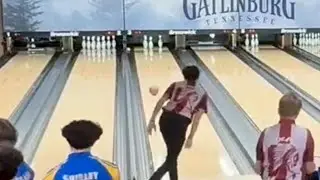 2 handed bowler throwing a backup ball to pick up a split. 
