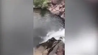 Cops release video of girl flipping off a waterfall