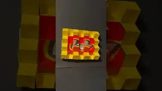 Эту скульптуру-оригами я сделал из бумажного пакета LEGO.