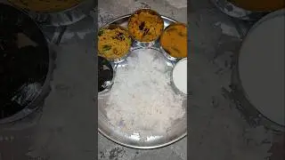 South Indian vegetarian lunch thali.chutney,semiya pulihora,curry,pappu,curd,rice.