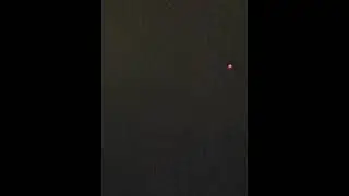 Red disc shaped object flying over Cali, Colombia during the riot.