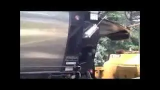 Live Bottom Trailer Asphalt paving under trees