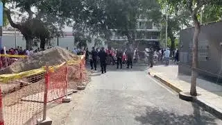 Crowd of people walking by the street, Petrol protest outside in Lima, Peru