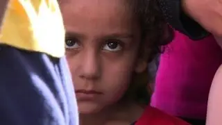 Even after fleeing war, migrants' hardship continues
