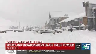 Skiers & snowboarders enjoy fresh powder on Marquette Mountain