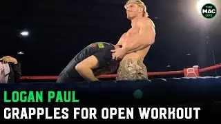 Logan Paul locks in a guillotine and grapples during open workouts
