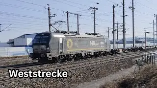 140 years e- mobility Beaconrail Vectron mit G&uuml;terzug auf der Weststrecke