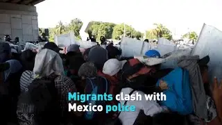 Migrants clash with police while en route to Mexico City