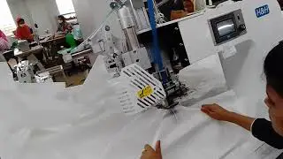 Seam sealing at sleeve join position. PPE manufacturing