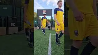 Norfolk county fa match officials bring the teams out
