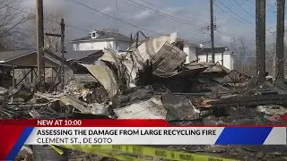 Assessing the damage one day after large recycling plant fire in De Soto