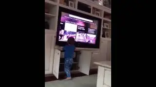 Baby thinks T.V. is giant ipad