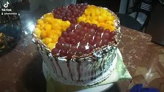 Final Touched of Fresh Fruits Chocolate Birthday Cake