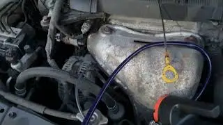 Engine oil drain through dipstick using a pump