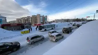 Record snowfall leaves cars stuck and people stranded in Russia's Far East