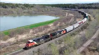 Awesome Aerial 4K View! Long Freight Train CN 407 Rounding the Bend at Dorchester, NB at Track Speed