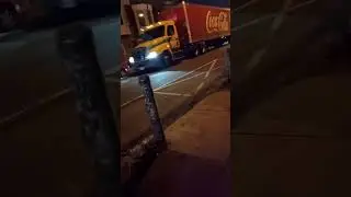 A Penske Freightliner Coca-Cola tractor trailer