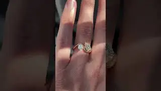 18 K YELLOW GOLD RING WITH PEAR AND ROUND DIAMONDS