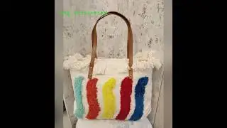This is a Rainbow Fringe Tote Bag,featuring a colorful rainbow design. price 699+Shipping