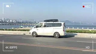 The Ford Tourneo Custom car has added a roof rack, the NEUMANN 305s and the black F5 roof box.