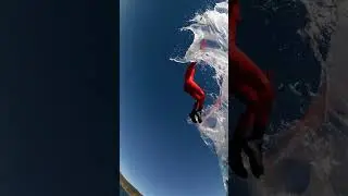 Impact The central jumper descends and hits the water
