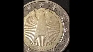 2 Euro error coin from Germany G 2002.Extra metal material,off center inner circle perimeter(No 35).