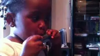 Baby plays the harmonica!