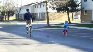Casey walking with dad on jumping stilts