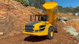 Burnies 114 Cat track loader loading the Vulpa a30g dumper