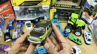 Some lot's of deicast cars, truck , tractor, defender, ambulance, helicopter, bike, Jeep, hotwheels