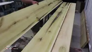 some rough looking poplar wood goes on the shop wall