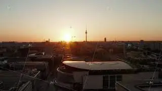 AERIAL: Flight over Berlin, Germany at beautiful Sunset, Sunlight and view on Alexanderplatz TV