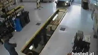Car drives in service pit