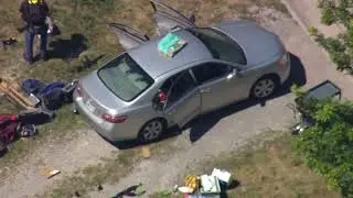 RAW Helicopter footage of rifles near car where police are investigating shooting of 3 Ohio officers